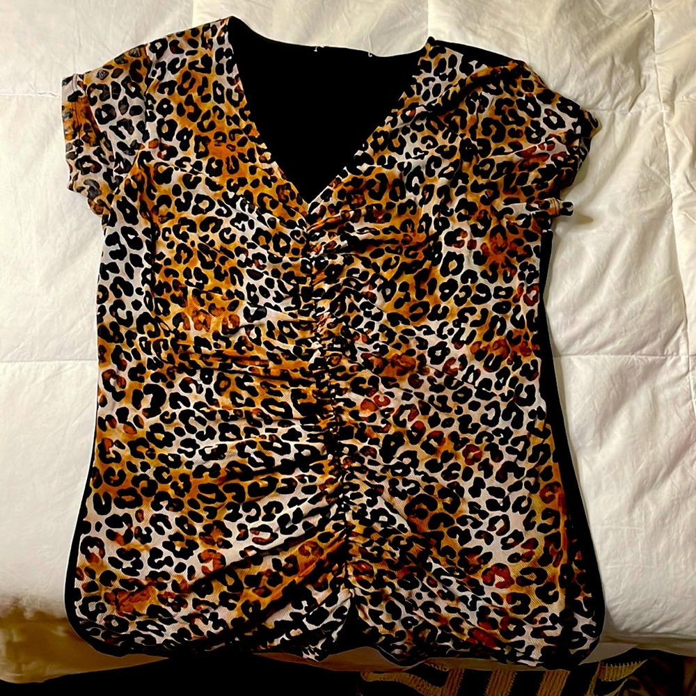 Cute leopard shirt! Brand New. Only worn 3 times.